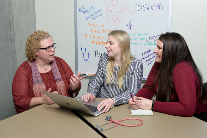 Students meeting with faculty