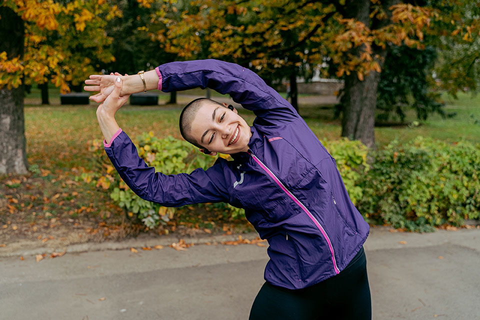 student exercising with a smile