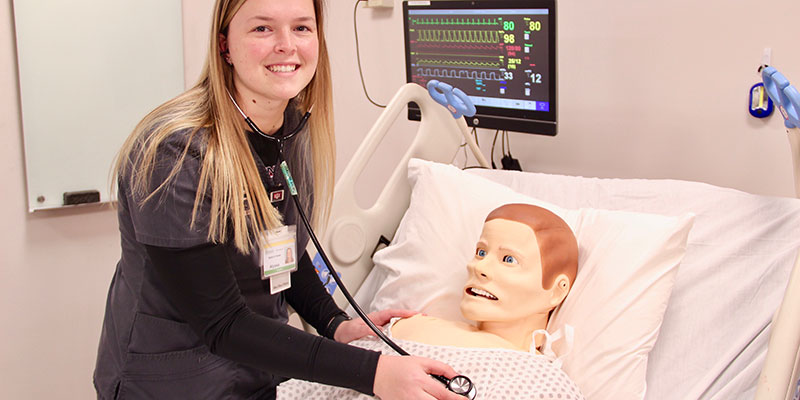 Nursing student with SIM man