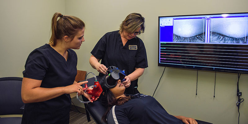 Student in hearing clinic