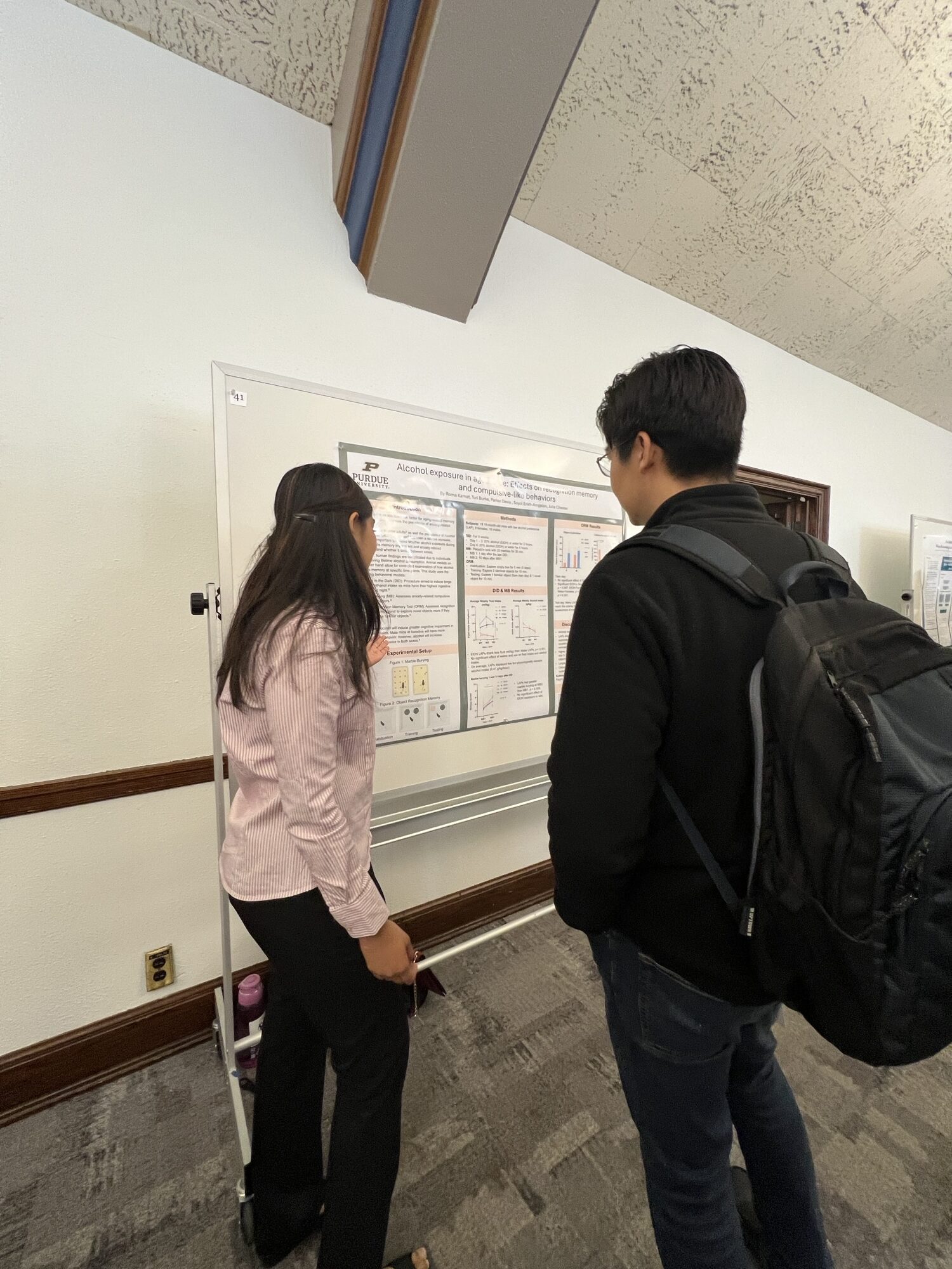 Students in front of research poster