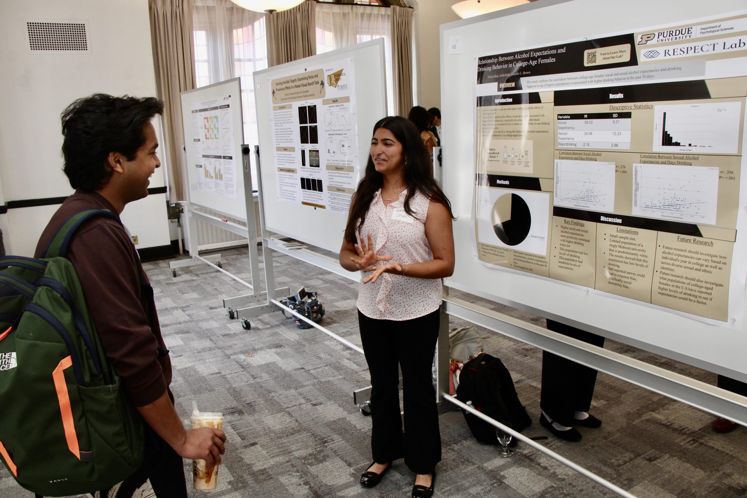 Student presenting poster at Psychological Sciences Undergraduate Research Conference