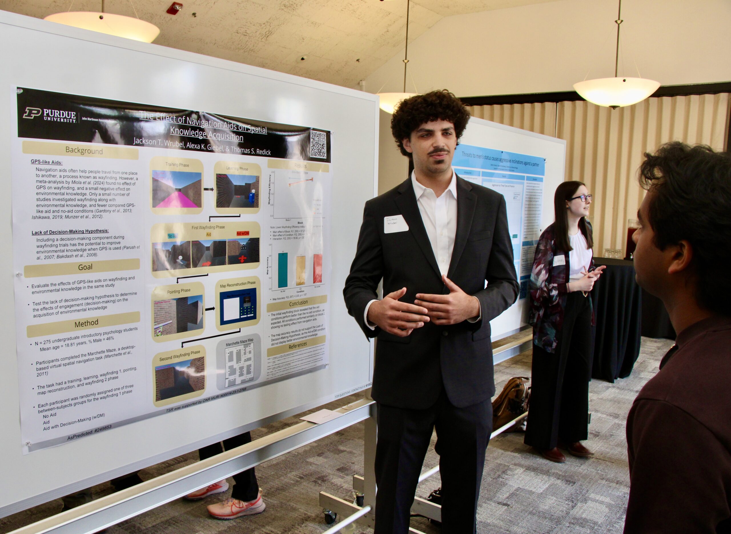 Student presenting poster at Psychological Sciences Undergraduate Research Conference