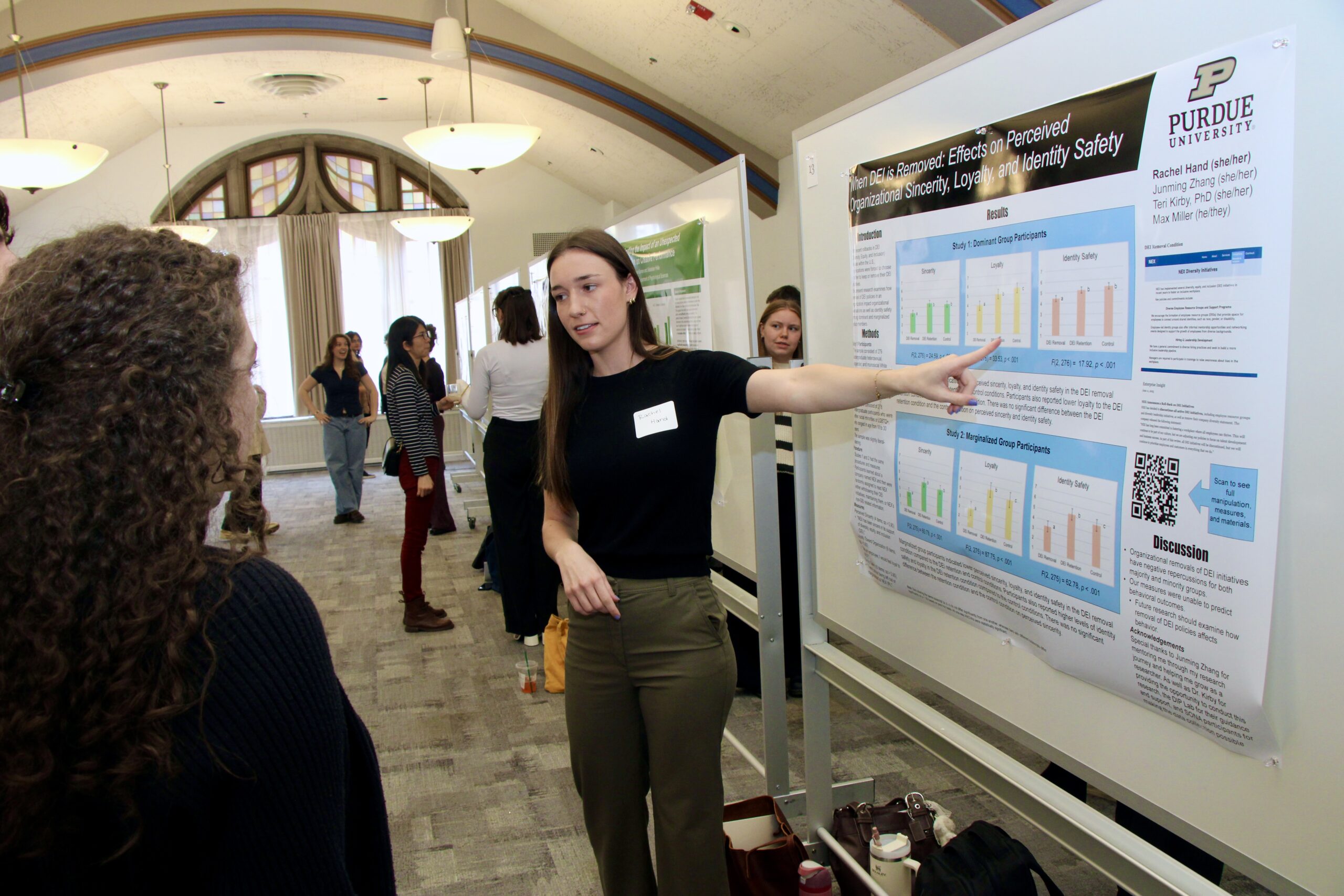 Student presenting poster at Psychological Sciences Undergraduate Research Conference