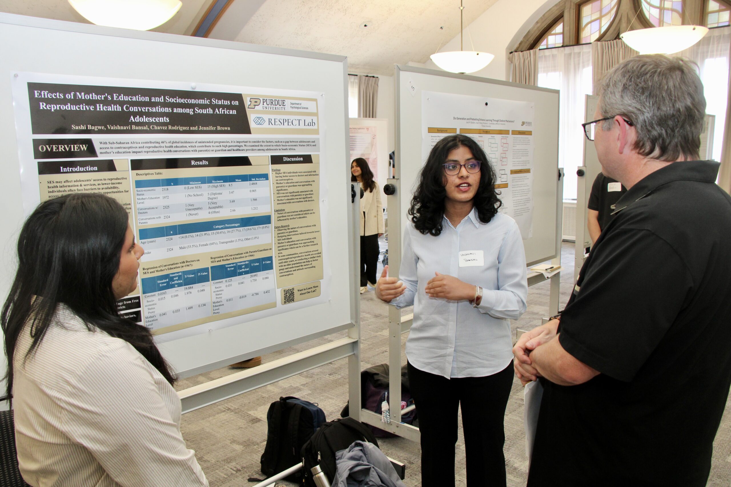 Student presenting poster at Psychological Sciences Undergraduate Research Conference